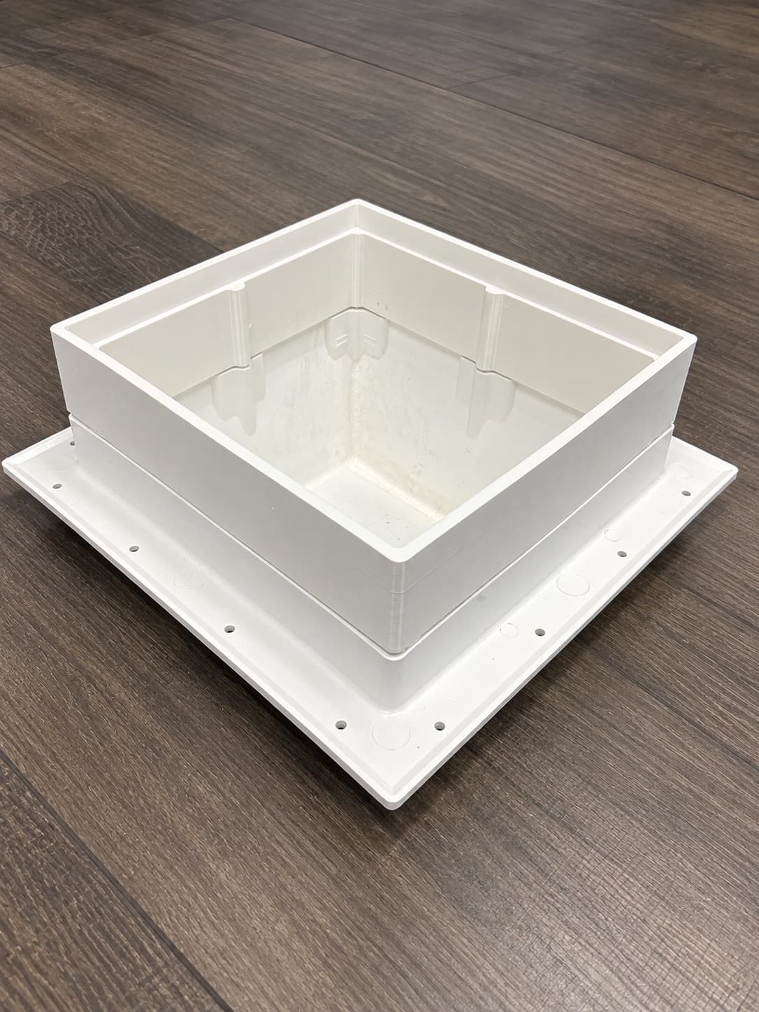 Large white 3D printed enclosure with a flanged base, printed in one piece on the large-format line